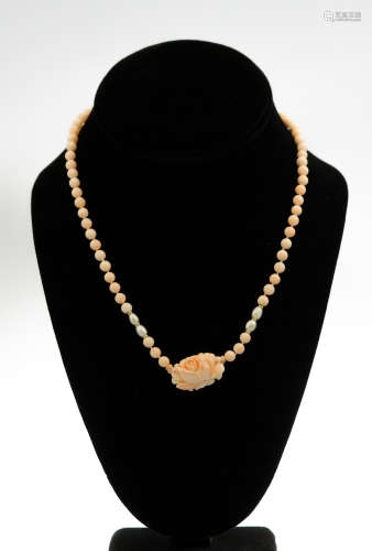 A vintage angel skin coral necklace