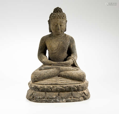 A lava stone carved seated buddha