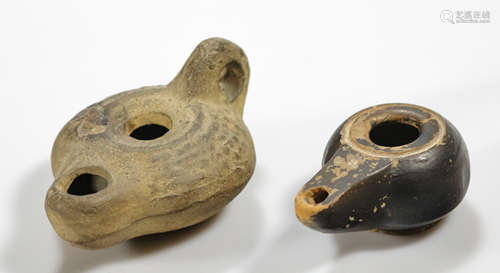 A pair of ancient Greek terracotta earthenware oil lamps