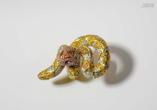 A large high quality gold over sterling designer ring depicts a snake