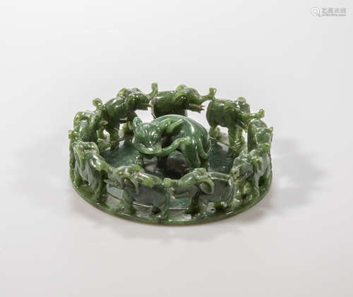 A carved spinach jade group figure depicting elephant in a circle