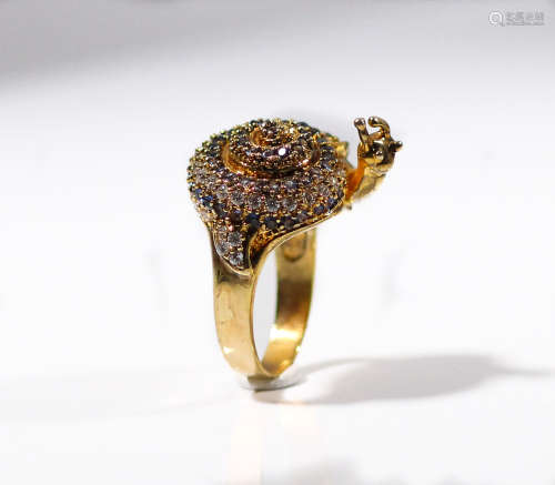 A large high quality gold over sterling designer ring depicts a snail