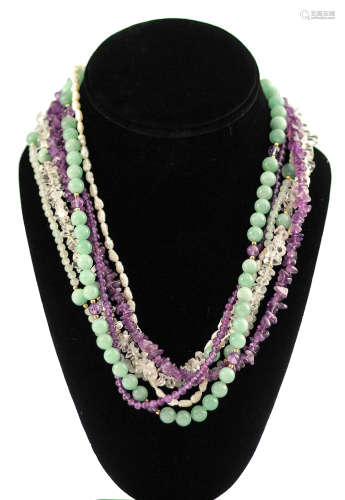 A vintage multi strand jadeite, turquoise, pearl and crystal necklace with sterling enclosure