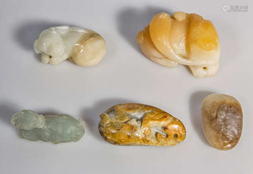 A fine lot of five jade/ hard stone carved figurines and pebbles