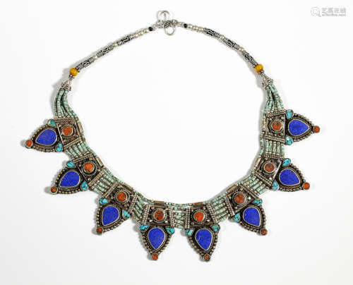 A vintage Egyptian revival collar necklace embellished with lapis, coral and turquoise