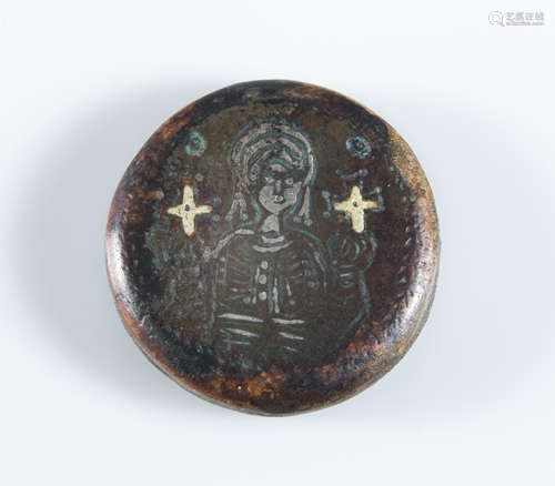 A scarce Byzantine bronze weight depicts the bust of a emperor with silver inlay