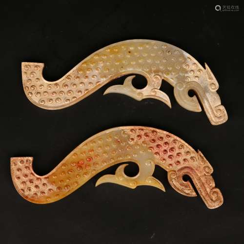 A PAIR OF JADE 'DRAGON-HEAD' PLAQUES, HUANG Warring Sta