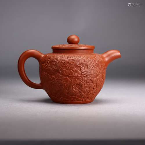 A Chinese Carved Yixing Teapot with lid