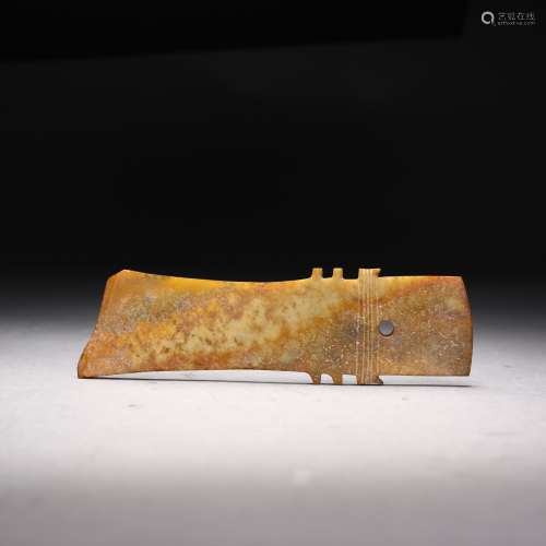 A PALE OLIVE AND RUSSET JADE BLADE, GUI