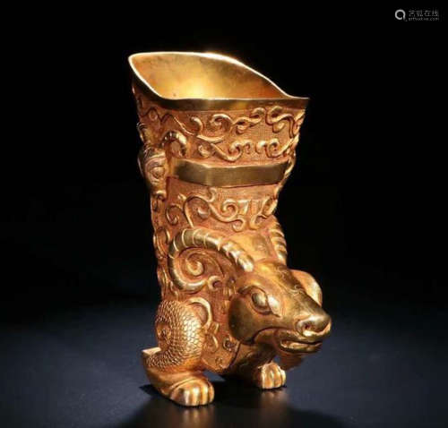 A COPPER GILT GOAT PATTERNED CUP