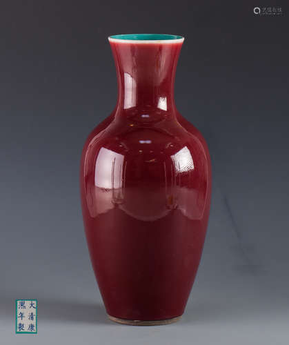 A RED GLAZE PORCELAIN VASE OF GUANYIN