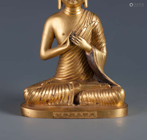 A COPPER GILT BUDDHA FIGURE