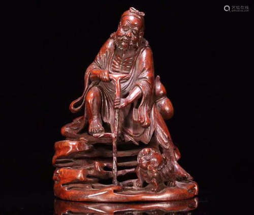 A BAMBOO WOOD DHARMA BUDDHA FIGURE