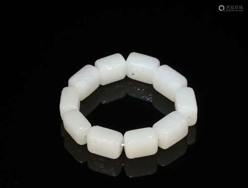 A HETIAN JADE BRACELET WITH XIANGYUN CARVED