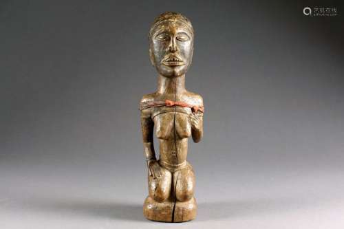 Figurine Kongo. Représentant une jeune femme ageno...;