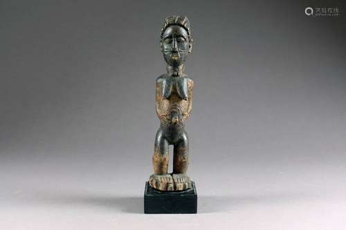 Culture Baoulé. Statuette représentant une femme d...;