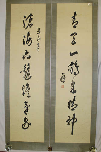 Chinese calligraphy Couplet on paper Scroll.