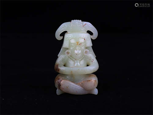 Chinese carved jade figure of a sitting man.