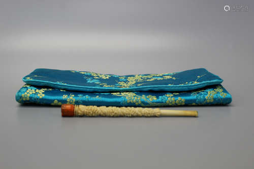 Chinese carved smoking pipe with embroidery pouch.