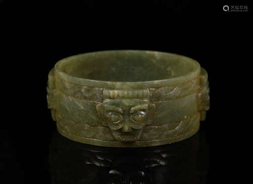 A Shang Jade Figure Bracelet