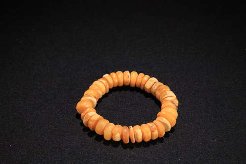 AN OLD BEESWAX BRACELET