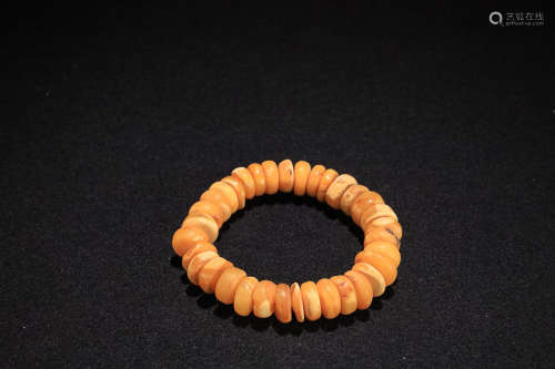 AN OLD BEESWAX BRACELET