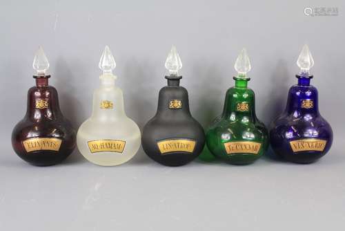 Four Inverted Teardrop Glass Apothecary Bottles