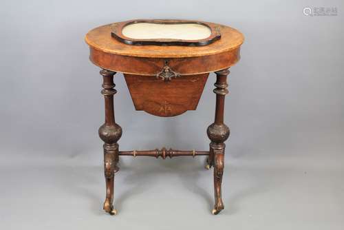 A Late Victorian Oval Walnut Sewing/Work Table