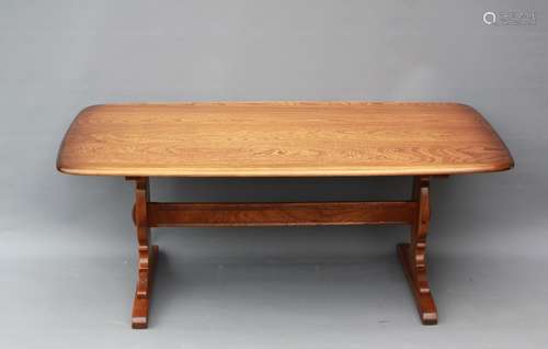 An Ercol Yew Wood Coffee Table, approx 140 x 66 x 52 cms