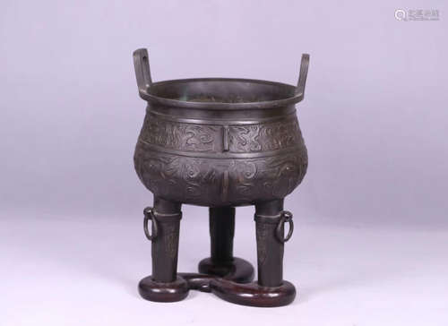 AN OLD BRONZE TRIPOD CENSER