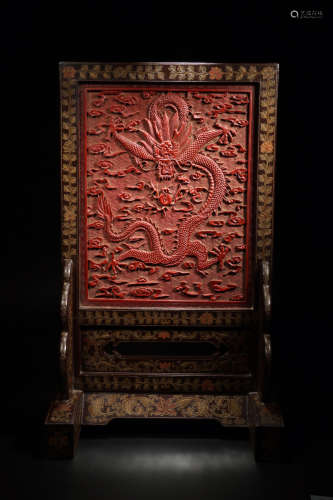 A RED LACQUER CARVED GILD SCREEN