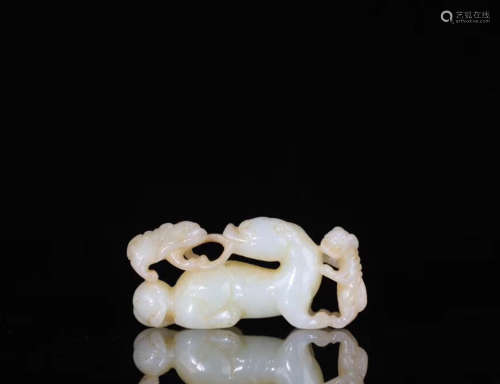 A HETIAN JADE CARVED LION SHAPED PENDANT