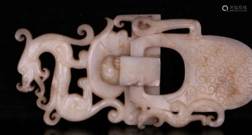 A JADE CARVED HOLLOW DRAGON SHAPED BUTTON