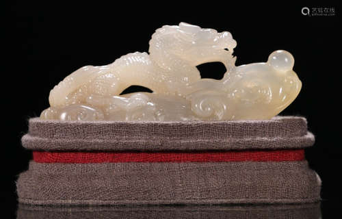 A QING DYNASTY SOAPSTONE CARVED DRAGON PATTERN ORNAMENT