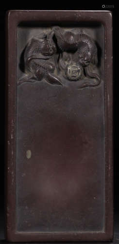 A PURPLE DUAN WOOD CARVED TWO LIONS INK SLAB