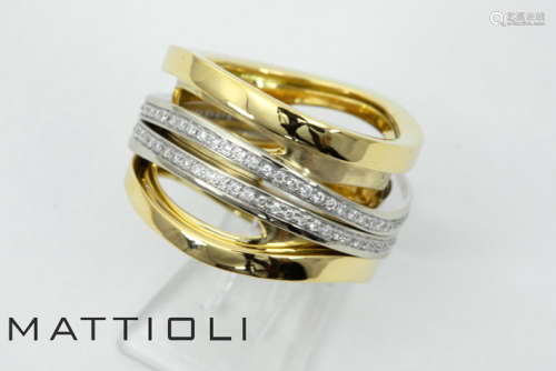 MATTIOLI ring met typisch draaimodel in wit een geelgoud (18 karaat) en bezet met ca [...]