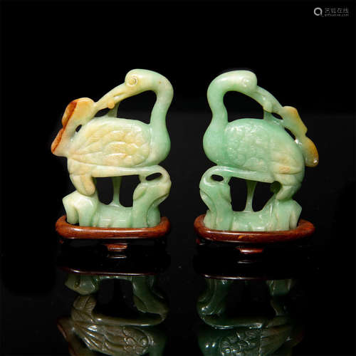 CHINESE GROUP OF TWO CARVED JADE CRANES, WOODEN STANDS