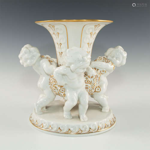 WHITE PORCELAIN CENTERPIECE WITH BASE OF 4 PUTTI SUPPORTS