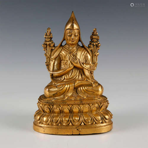 18TH CENTURY MOLDED GILT BRONZE TIBETAN LAMA FIGURE