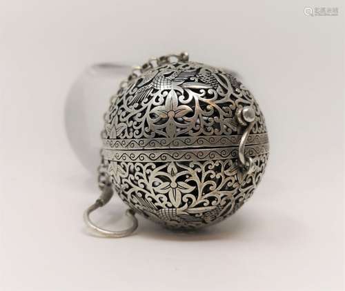 A SILVER INTRICATE SELF-BALANCING INCENSE BURNER