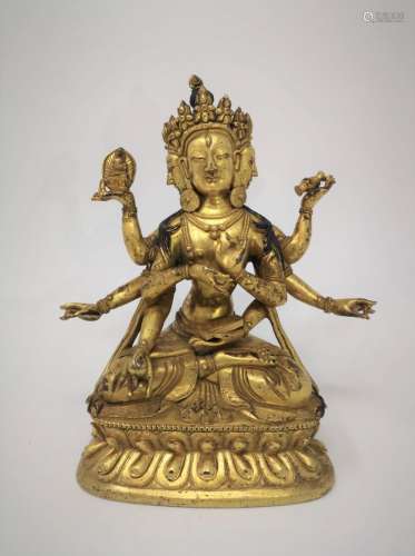 A GILT EIGHT-ARM BUDDHA STATUE