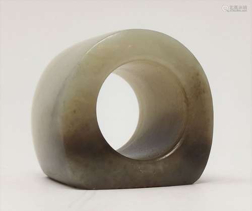 A GREEN JADE THUMB RING WITH A INSCRIBED SEAL