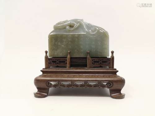 A FINELY CARVED AND INSCRIBED LARGE HE-TIAN JADE SEAL