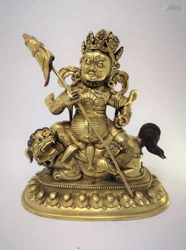 A GILT TREASURE KING STATUE