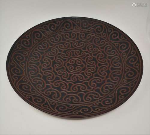 A LARGE “TI XI” CARVED LACQUER PLATE