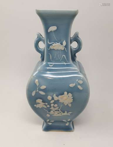 A CHINESE SKY BLUE VASE WITH PROMINENT WHITE FLORAL