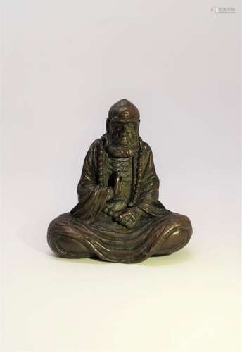 A SMALL BRONZE STATUE OF BODHIDHARMA