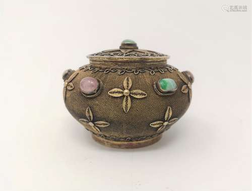 A GILT SILVER CONTAINER WITH PRECIOUS STONES