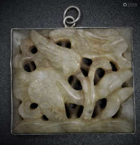 AN OLD JADE PIECE WITH SILVER FRAME (YUAN DYNASTY)