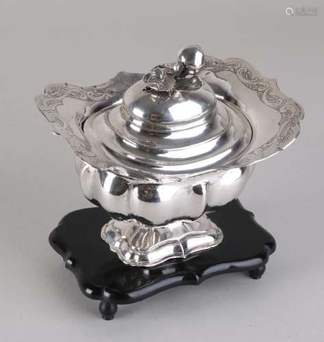 Silver tobacco jar, 833/000, on black wooden base.Â